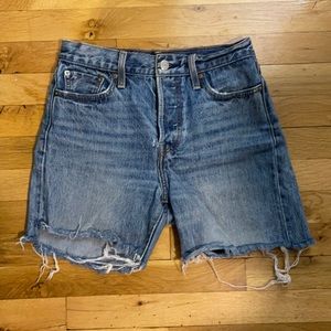 Vintage high waist mid-leg Jean Levi’s shorts.
